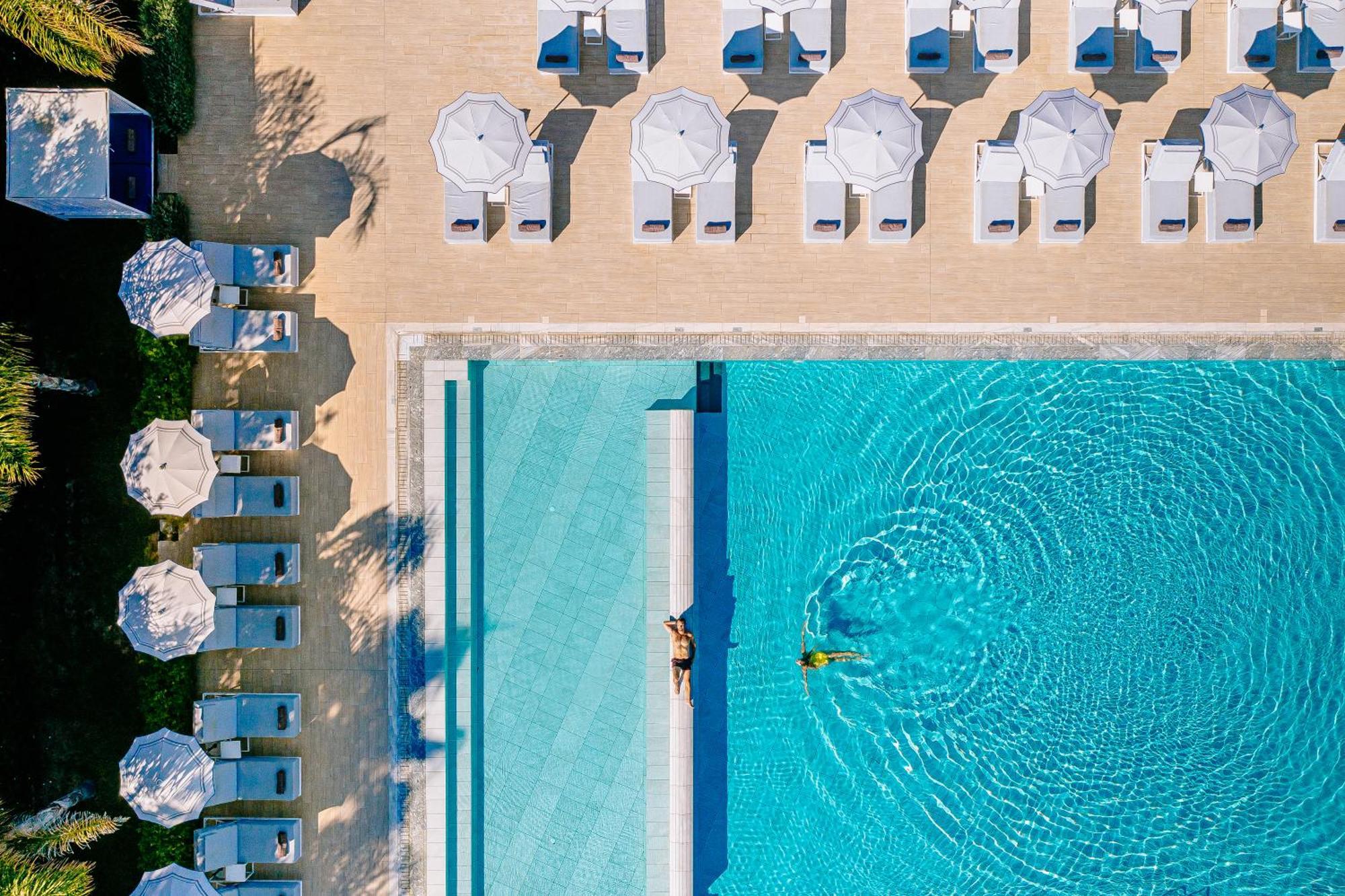 Ivi Mare - Designed For Adults By Louis Hotels Geroskipou Exteriör bild Aerial view of the pool at the Hotel du Cap-Eden-Roc, Cap d'Antibes, France